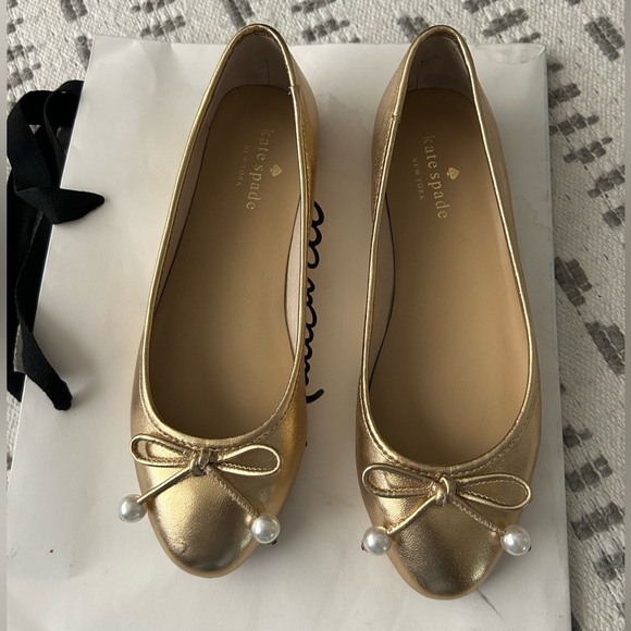 kate spade Shoes - Kate Spade Gold Loafers with Bow Detail